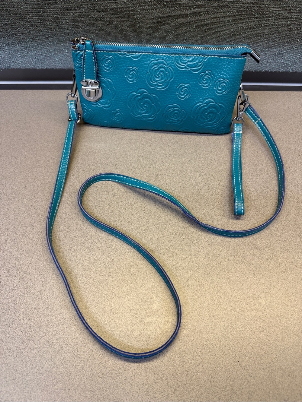 Mellow World Teal Floral Embossed Crossbody Wristlet